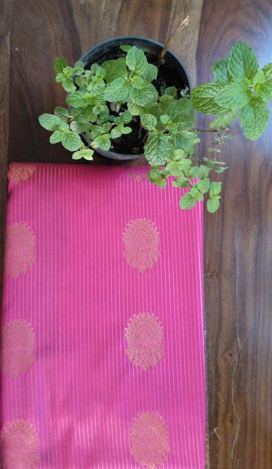 Teal Pink Saree with Golden Zari Butta & Wide Border - Saree Display on Table