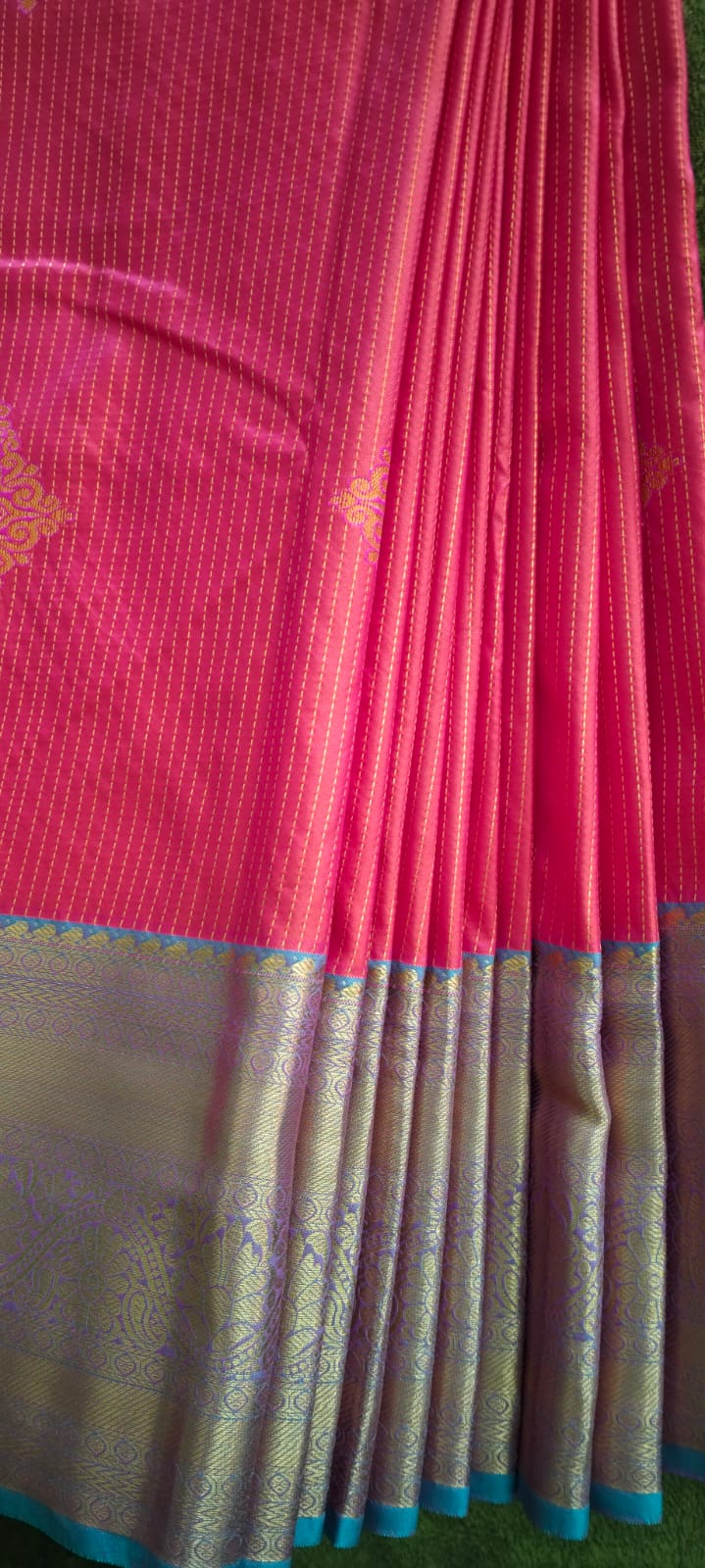 Vibrant Pink Semi-Silk Saree with Gold Butta & Multicolor Zari Border - Elegant Drape Display