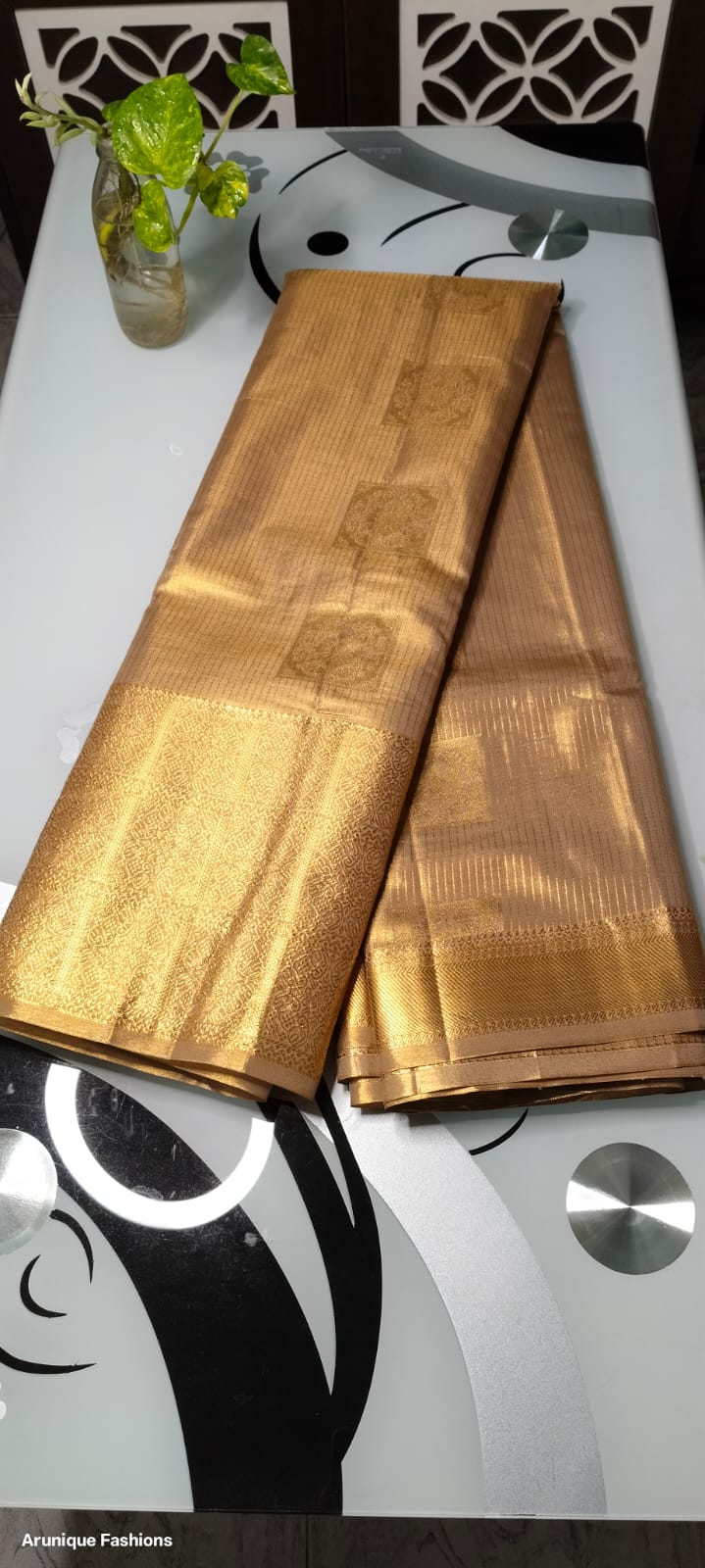 Pale Gold Shimmer Semi-Silk Saree - Saree Display on Glass Table