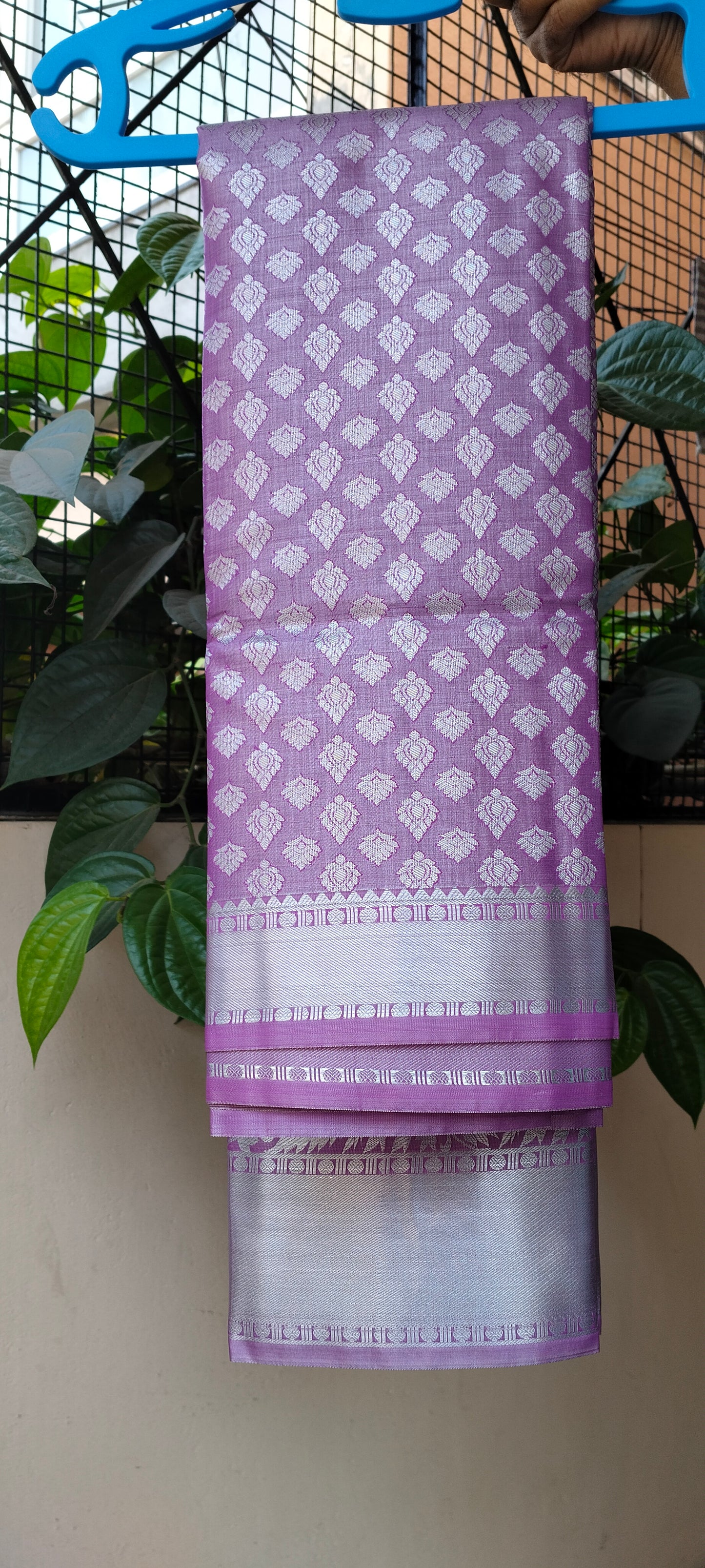 Lavender Brocade Semi-Silk Saree with Silver Tissue Border - Saree on Hanger with Border Detail