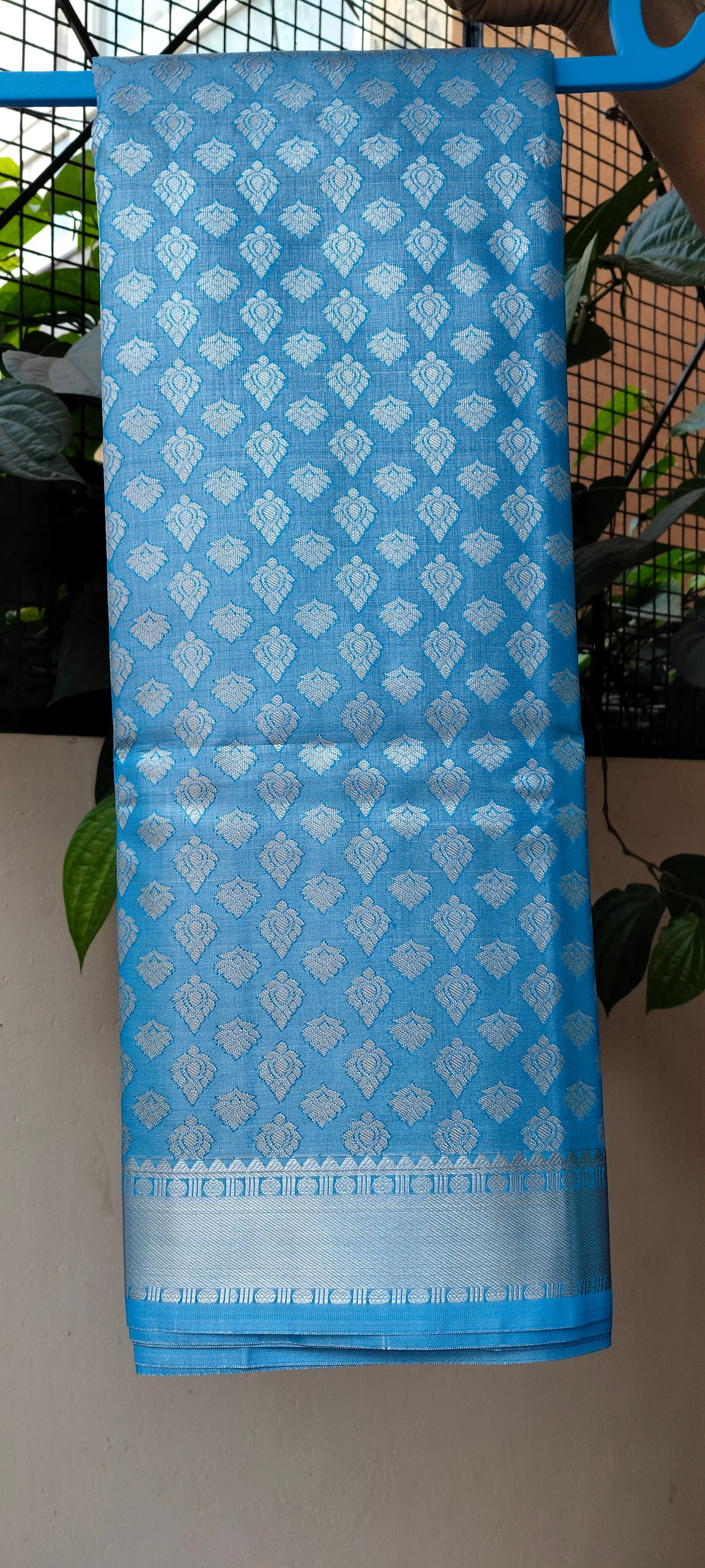 Sky Blue Brocade Semi-Silk Saree with Silver Tissue Border - Saree on Hanger with Border Detail