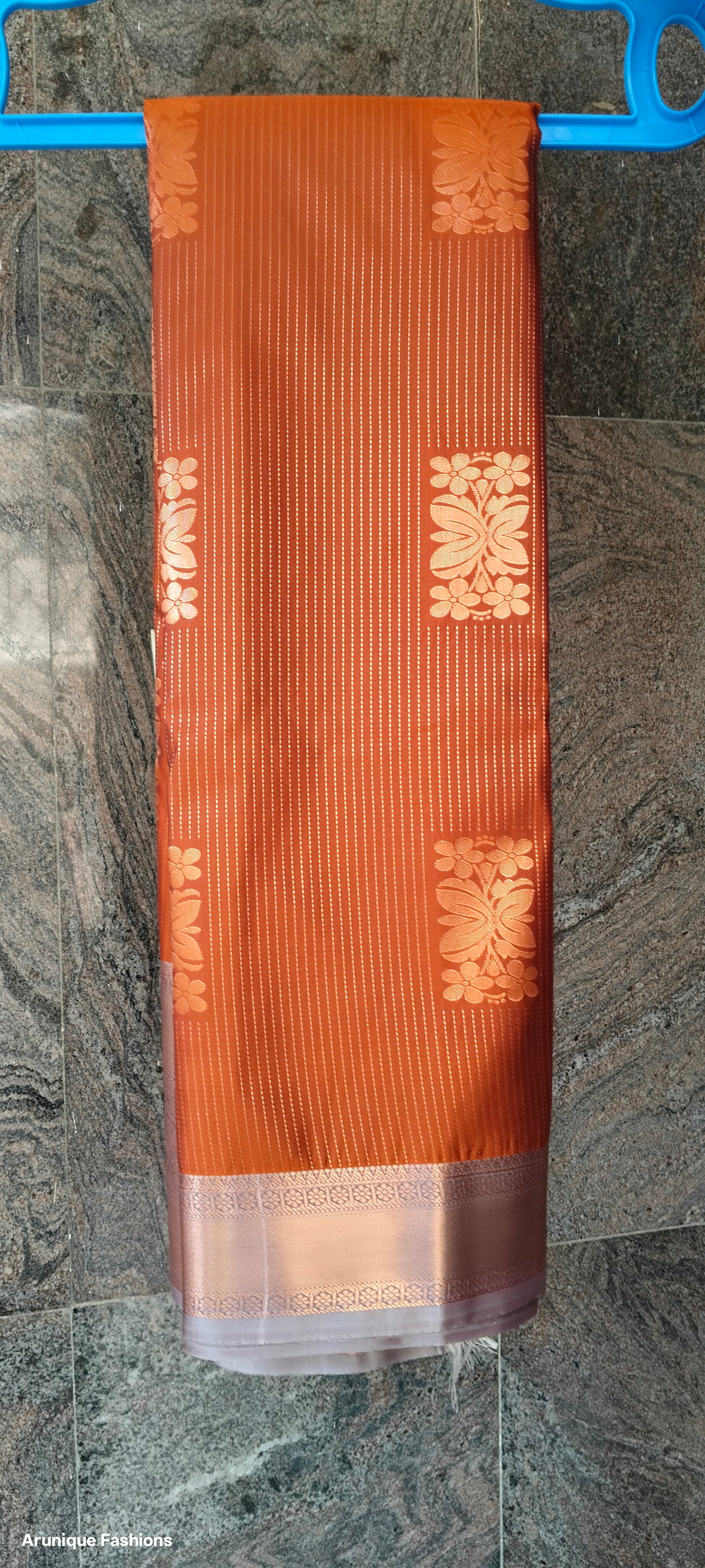 Rust Orange Golden Shimmer Semi-Silk Saree - Saree on Hanger with Border Detail