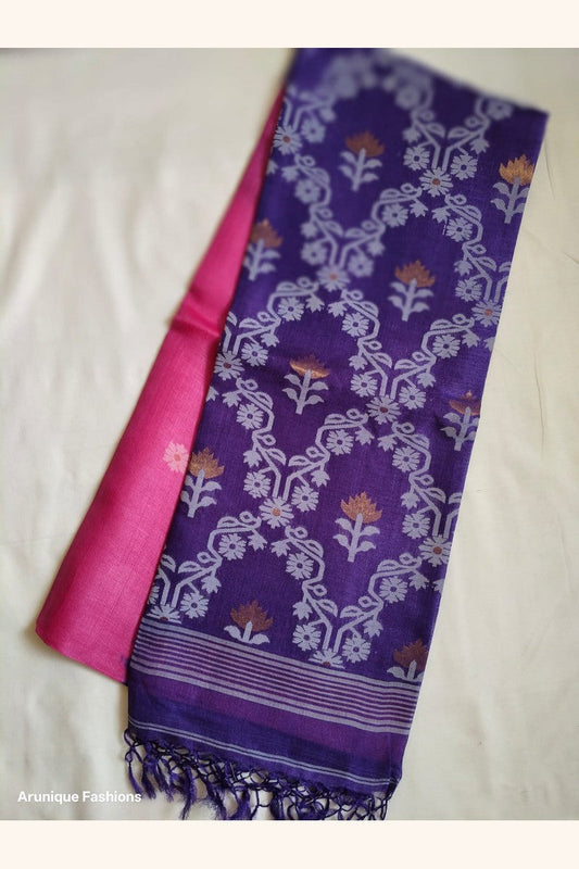 Flat lay of Pure Tussar Silk Saree showing royal purple all-over ikat lotus and floral vine weave pallu alongside hot pink body
