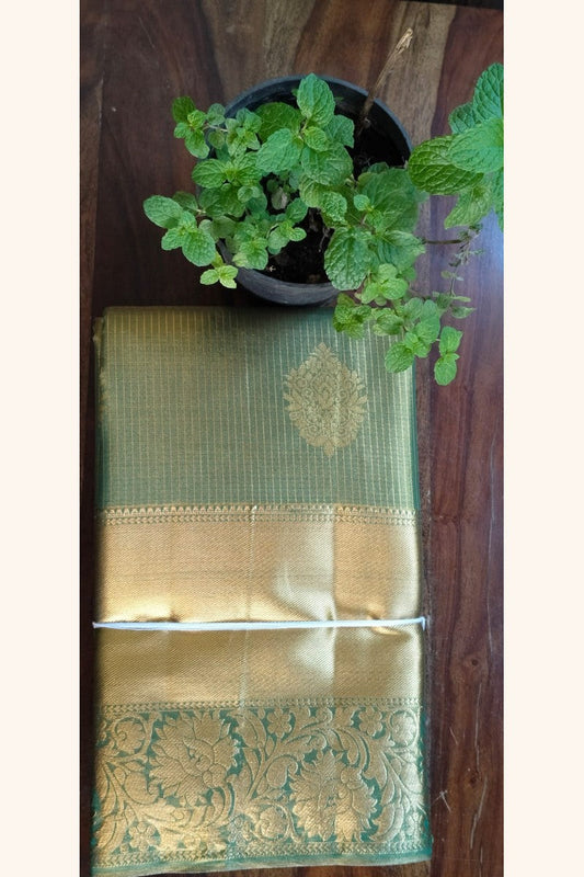 Mehndi Green Gold Striped Saree with Golden Zari Butta & Wide Border - Body Display on Table