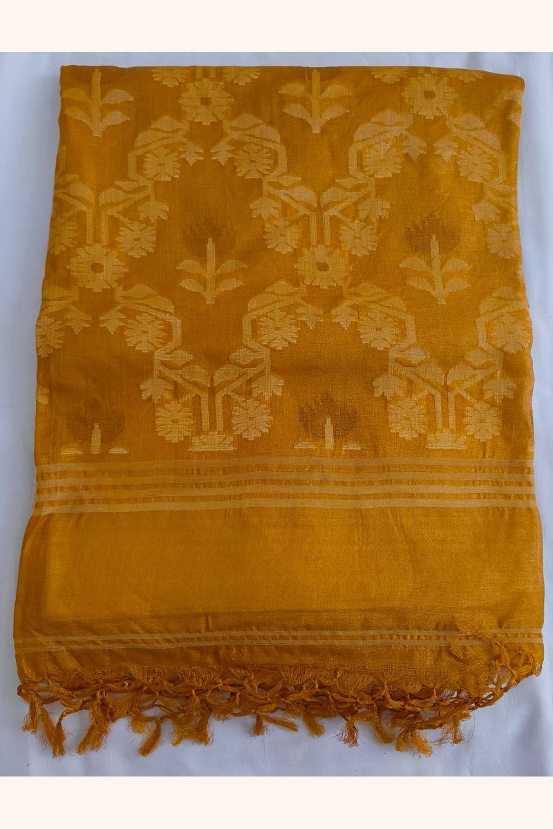 Folded Pure Tussar Silk Saree showing mustard gold ikat floral tree weave pallu with tone-on-tone motifs and mustard tassels