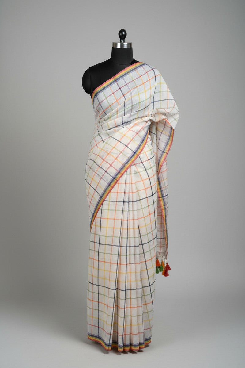 Black mannequin display of off-white rainbow checks mul cotton saree
