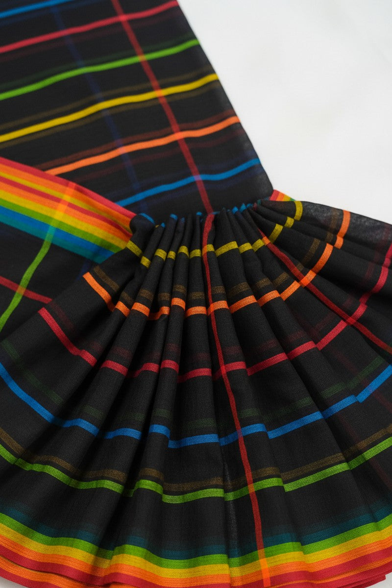 Close-up of pleats detail on black rainbow checks mul cotton saree