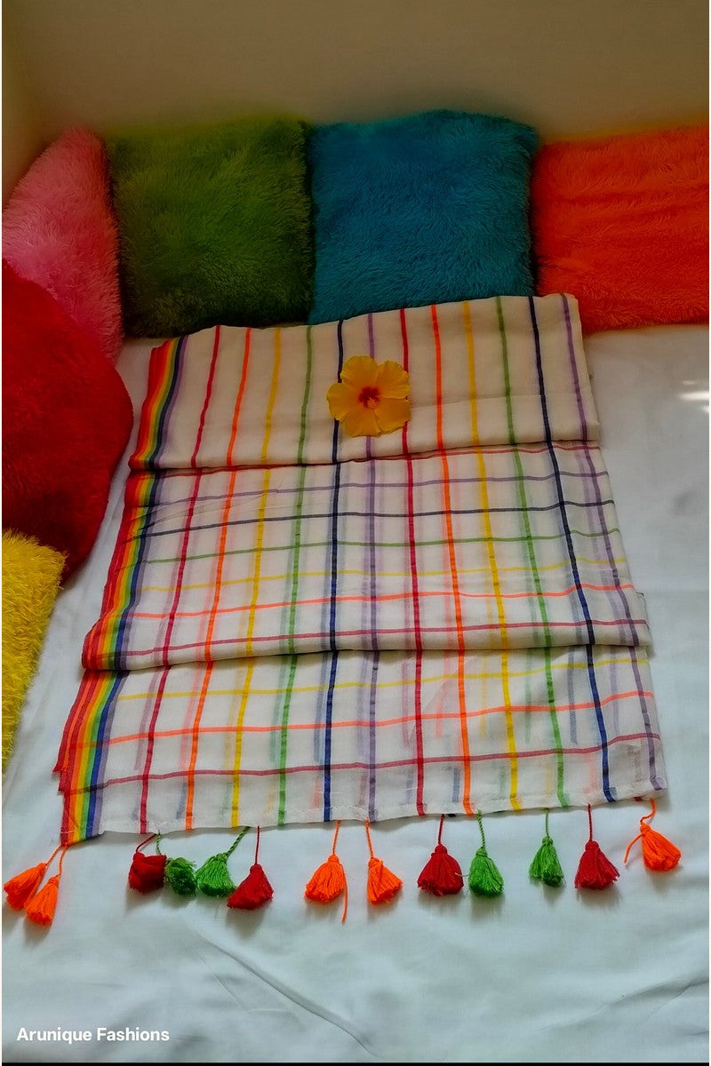 Off-white rainbow checks mul cotton saree displayed with pillows