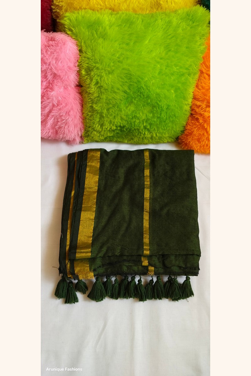 Dark green double zari mul cotton saree with golden borders and hand-tied tassels displayed folded