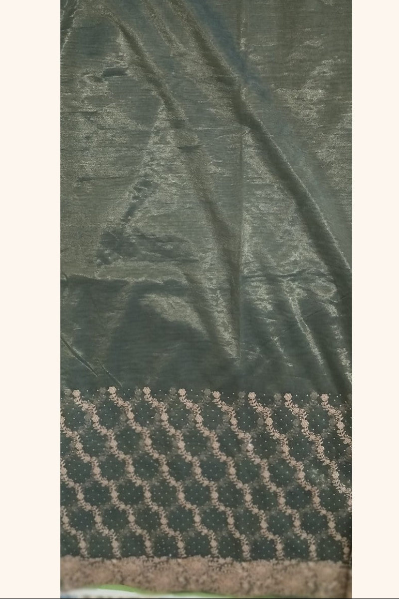 Dark olive green designer net saree - plain sheer net upper half with stone embellishments and diagonal gold zari embroidery on lower half
