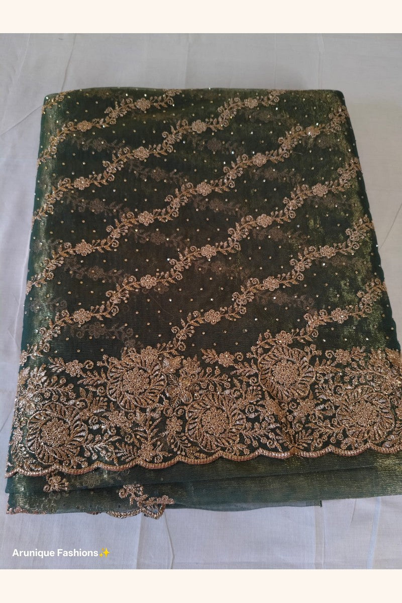 Dark olive green designer net saree with gold zari embroidery - flat lay