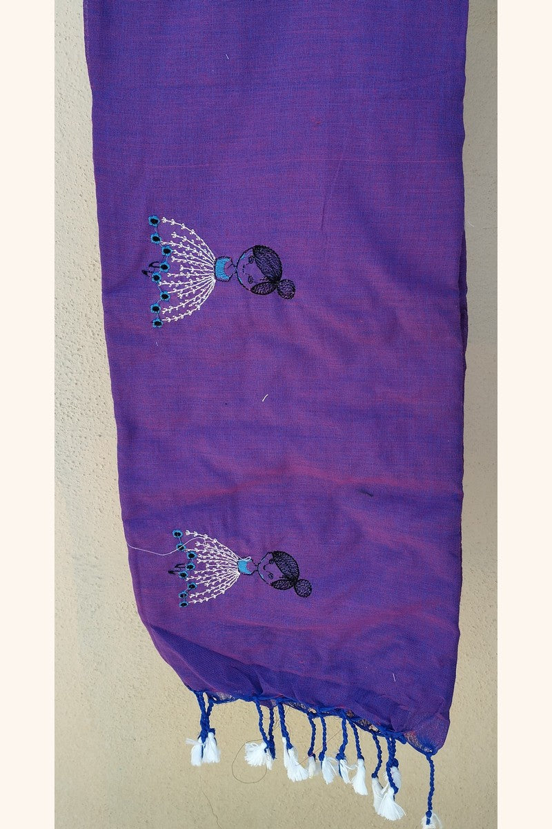 Close-up of embroidered baby doll motif fabric texture on dual shade purple khadi
