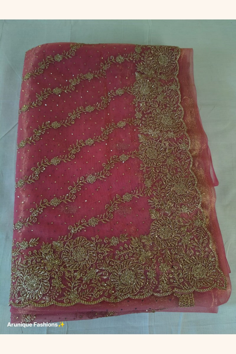 Dusty rose net saree pallu flat lay - diagonal gold zari floral vine embroidery and sequin butis