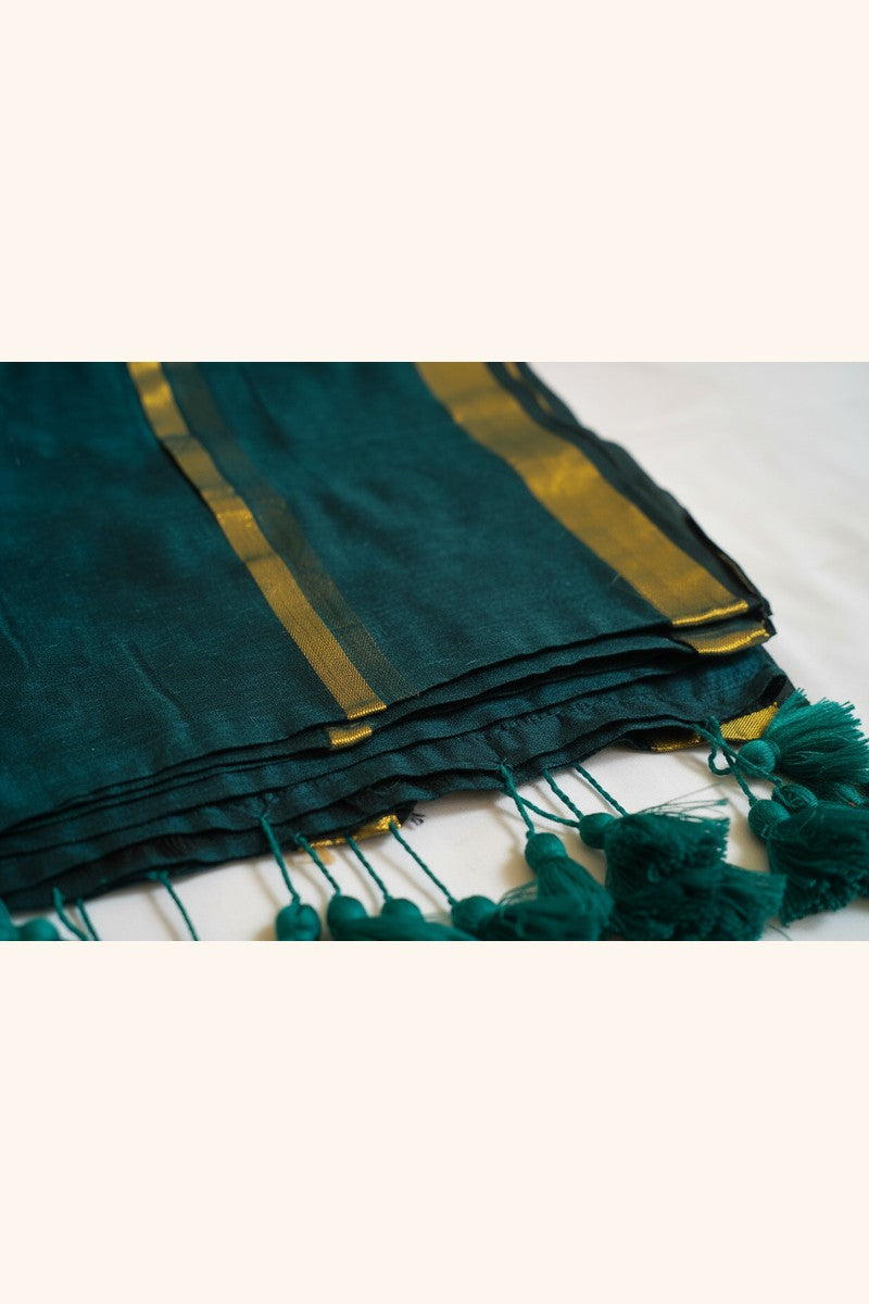 Emerald Green Double Zari Mul Cotton Saree - Folded with hand-tied tassels visible