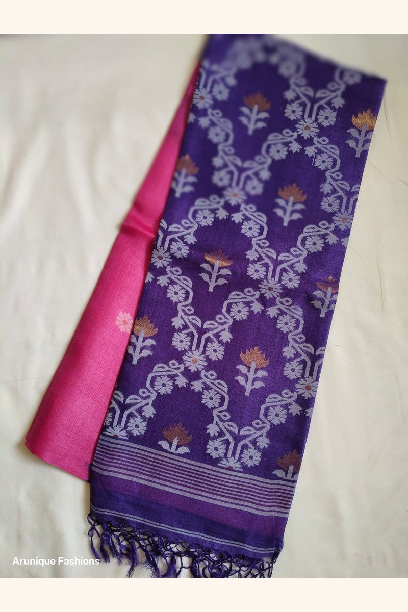 Flat lay of Pure Tussar Silk Saree showing royal purple all-over ikat lotus and floral vine weave pallu alongside hot pink body