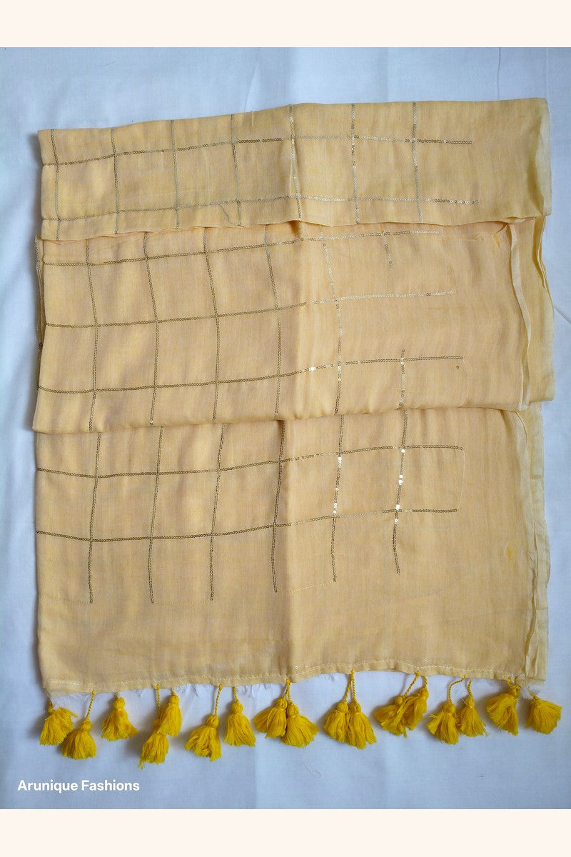 Soft pastel yellow mul cotton saree with sequin grid work - full pallu view with hand-tied yellow tassels