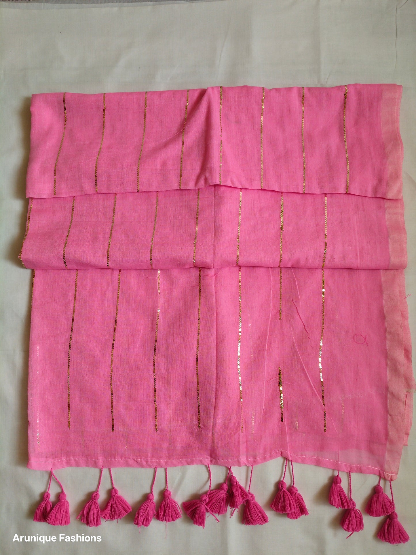 Trendy pink sequin mul cotton saree - folded view showing fabric drape and texture