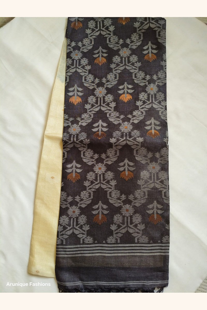 Pure Tussar Silk Saree folded showing charcoal black ikat body with cream border contrast