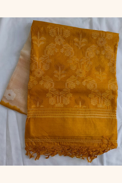 Folded Pure Tussar Silk Saree showing cream body with self-woven floral butti motifs and mustard gold ikat border with tassels