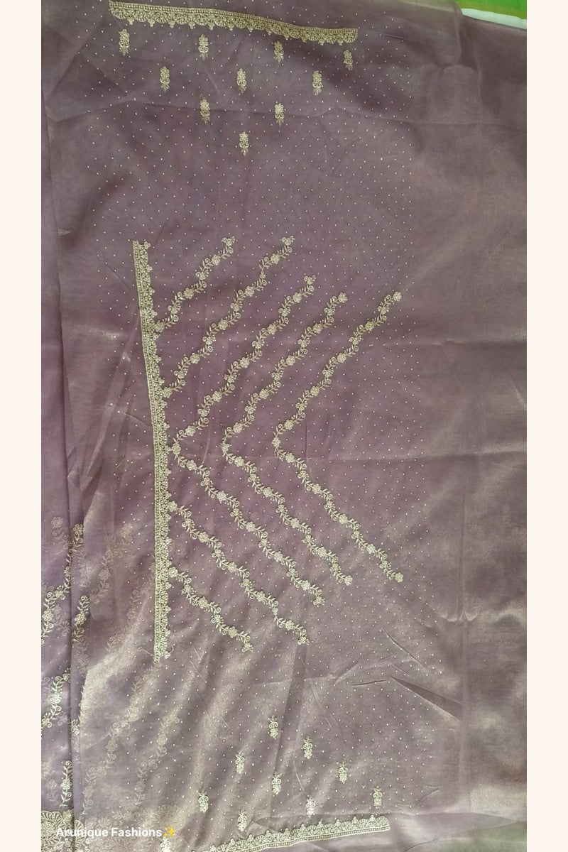 Mauve premium designer net saree - blouse spread showing gold zari floral motifs and heavy scalloped gold border