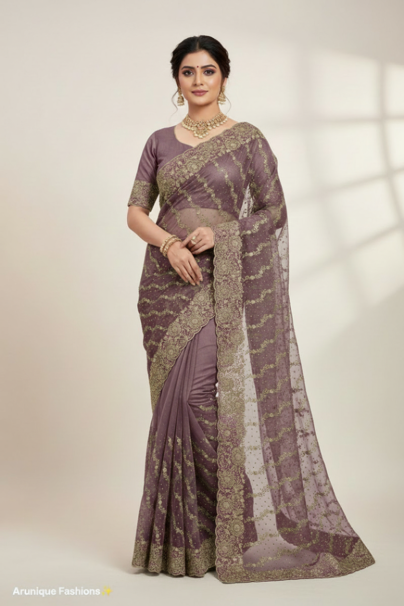 Mauve premium designer net saree on model - full body gold zari embroidery with scalloped border