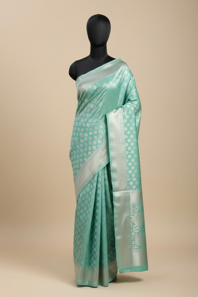 Mannequin display of mint green brocade semi-silk saree
