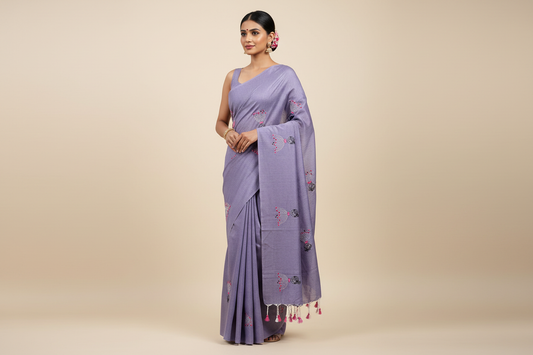 Model wearing lavender embroidered saree