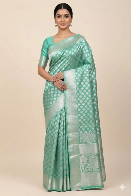 Model wearing mint green brocade semi-silk saree in full drape