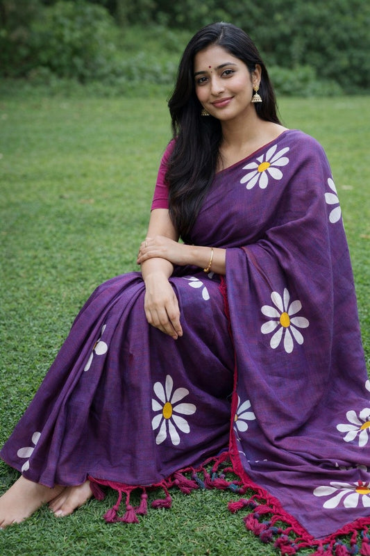 Model sitting on lawn wearing dual tone purple sunflower khadi saree