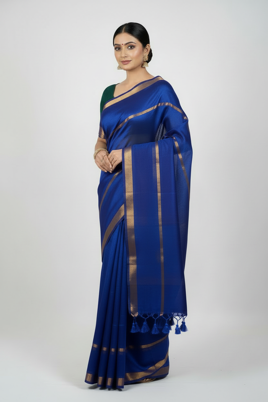 Model wearing royal blue double zari mul cotton saree with golden borders - 120 thread count premium fabric