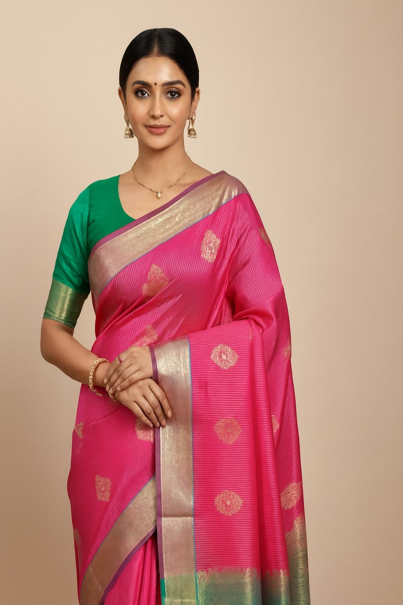 Model wearing vibrant pink semi-silk saree in full drape