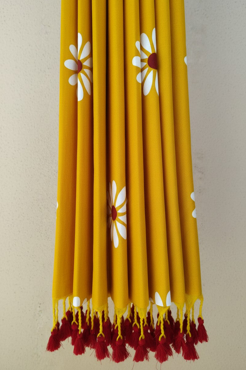 Pleats detail with yellow and maroon tassels on yellow sunflower khadi saree