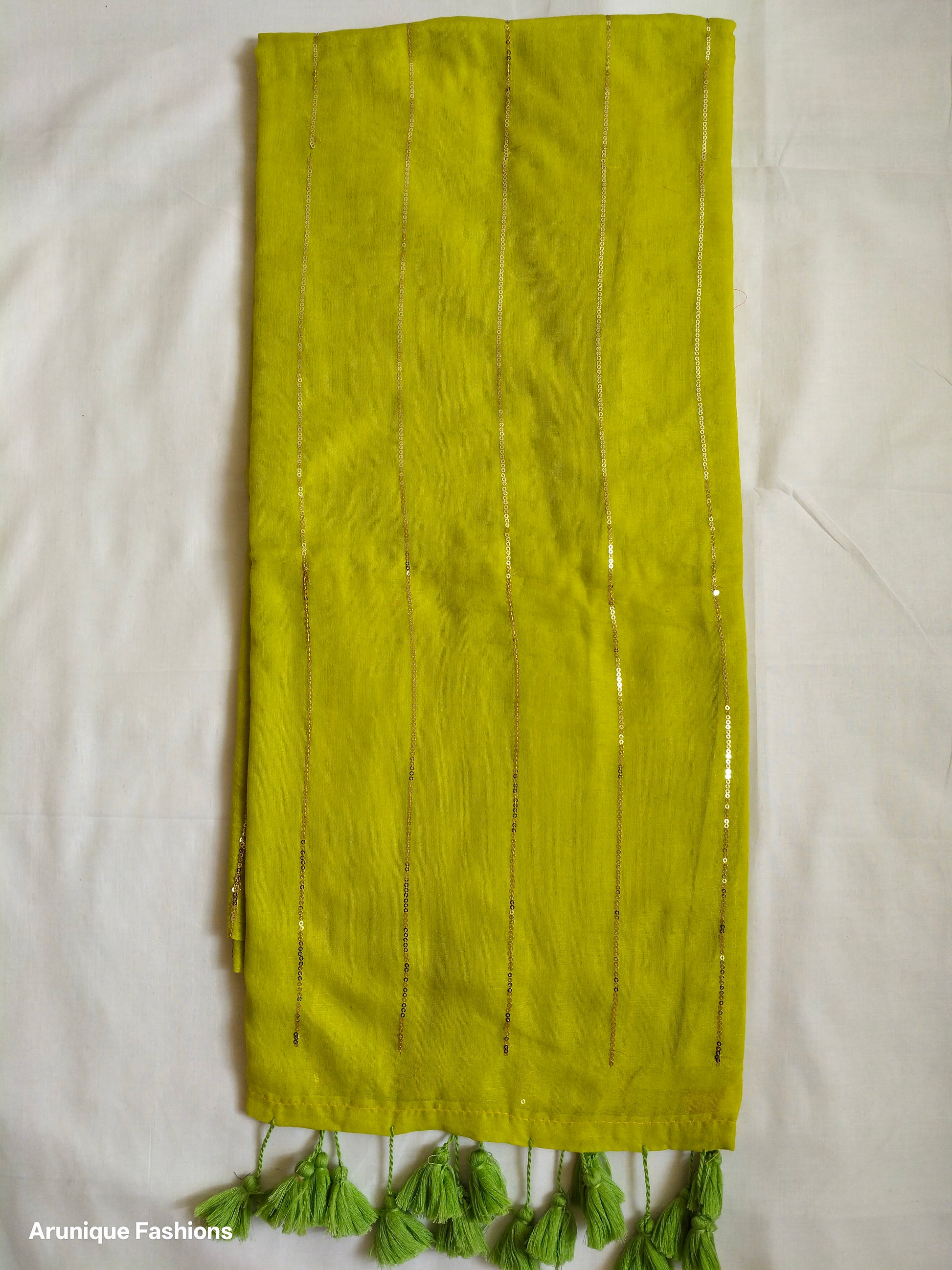 Lime yellow mul cotton saree with vertical sequin work - full pallu view with green tassels