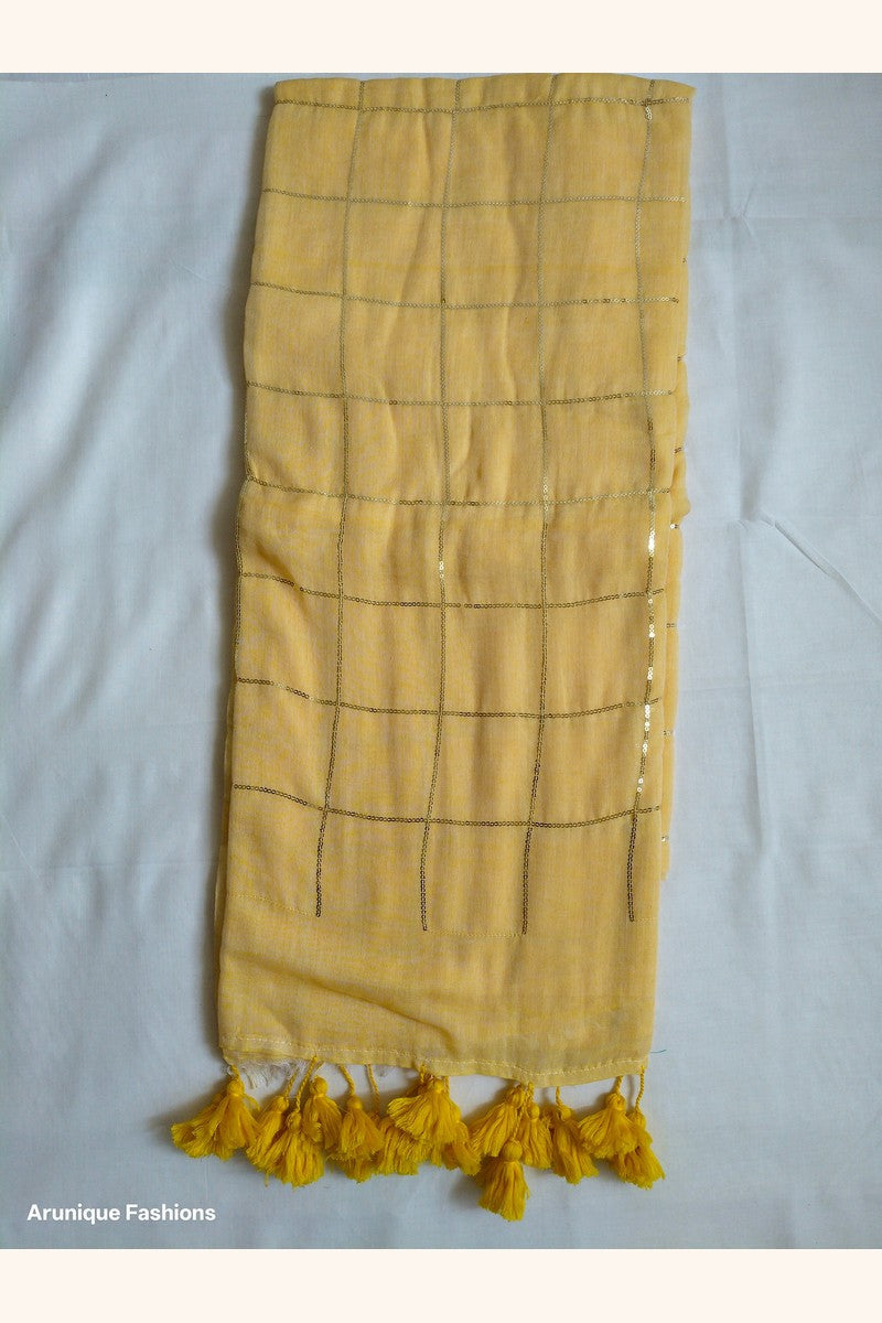 Trendy soft pastel yellow sequin mul cotton saree - full view with yellow tassels and grid pattern