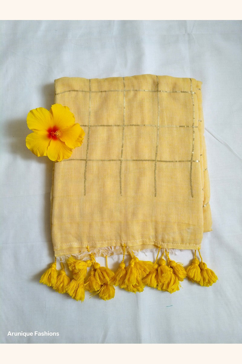 Soft pastel yellow mul cotton saree with golden sequin grid - fabric texture detail with decorative flower