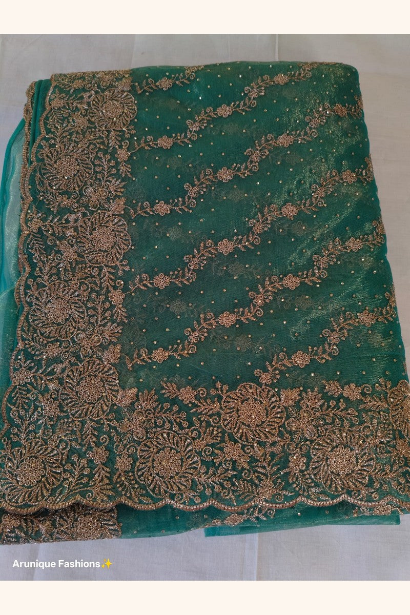 Teal green designer net saree - pallu with dense gold zari floral embroidery with stone and sequin embellishments