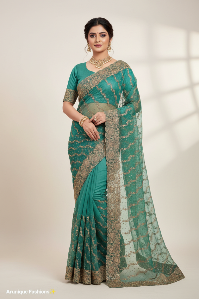 Teal green net saree on model - gold zari embroidery pallu and scalloped border