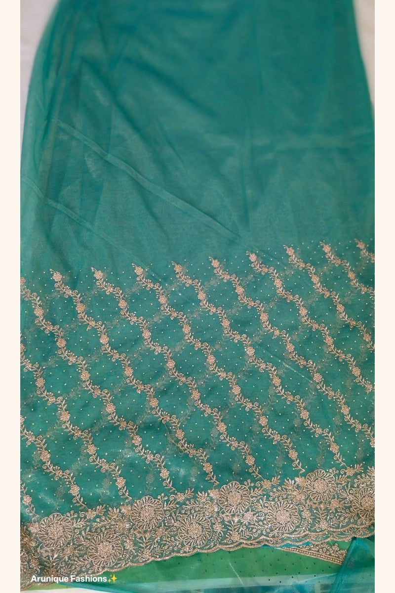Teal green designer net saree - scalloped gold zari border with large floral medallion motifs