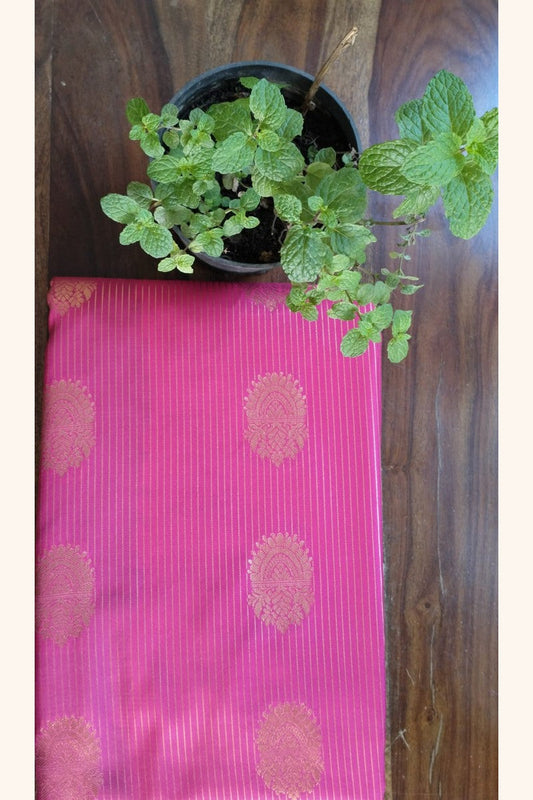 Teal Pink Saree with Golden Zari Butta & Wide Border - Saree Display on Table