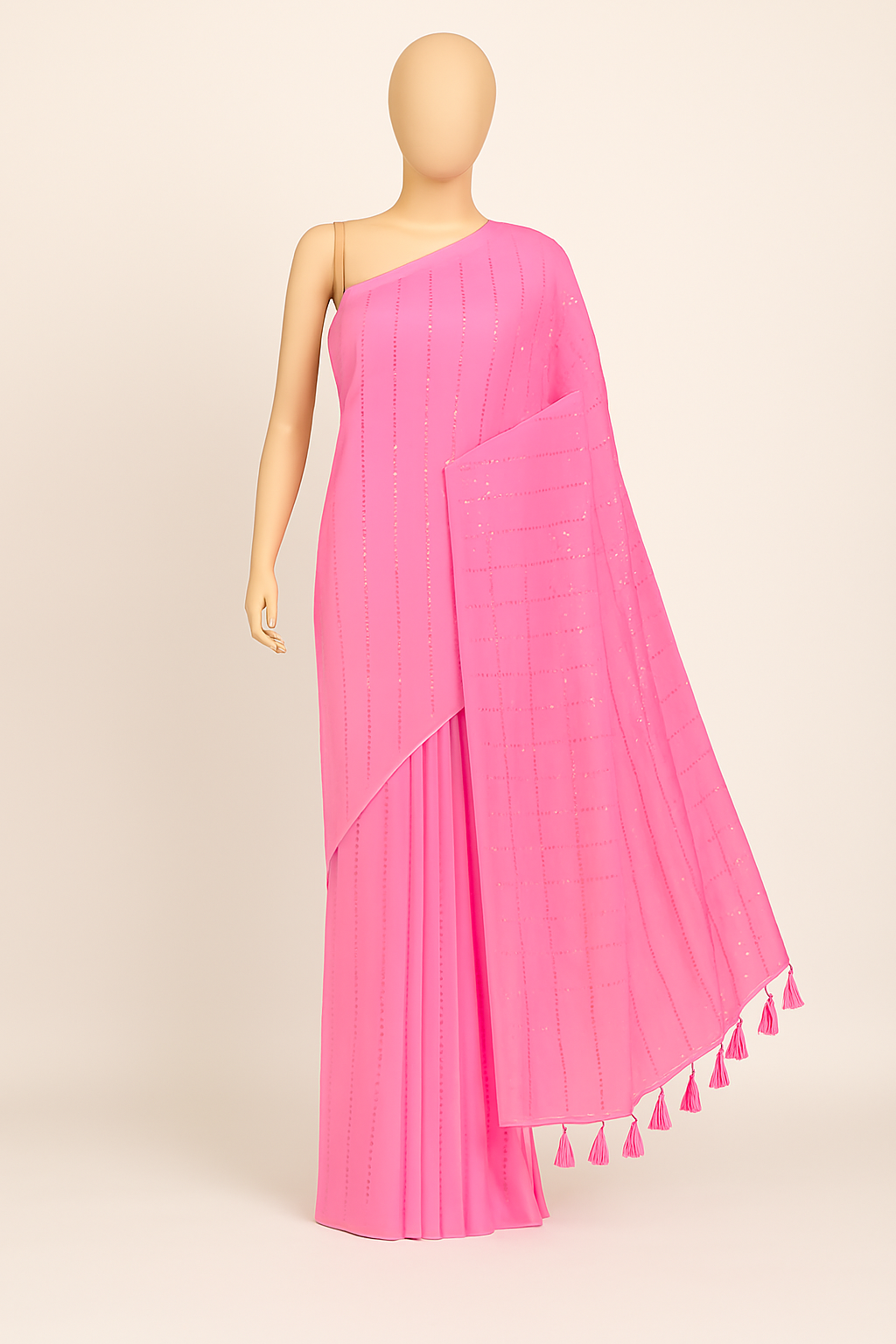 Pink sequin mul cotton saree displayed on black mannequin - full drape view