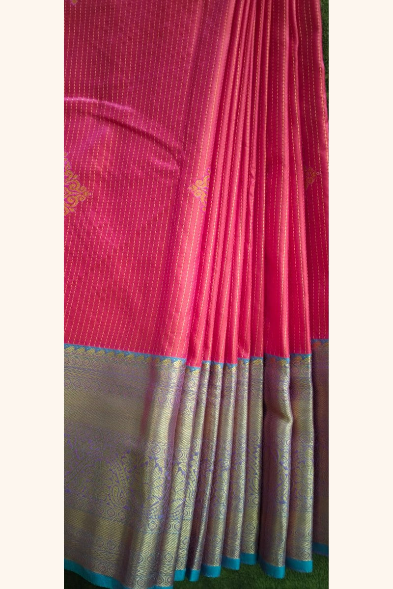 Elegant drape display of vibrant pink semi-silk saree