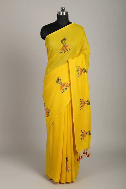 Mannequin display of yellow baby doll motif khadi saree